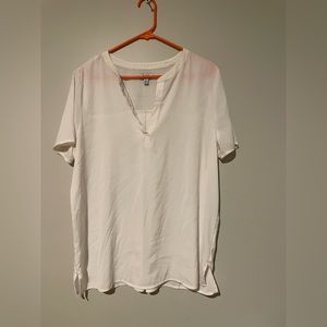 A beige shirt with buttons